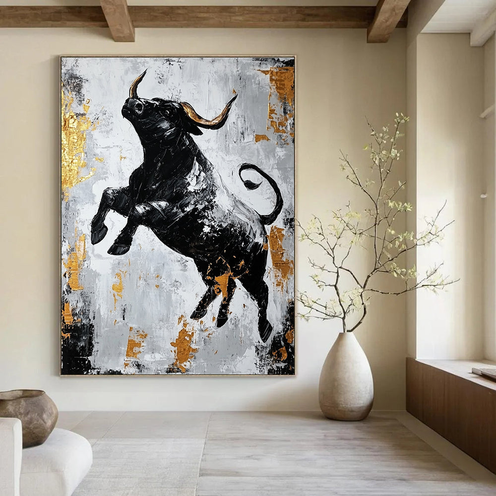 Large abstract painting featuring a dynamic black bull in gold and gray with strong contrasts and rough brushstrokes conveying powerful strength.STSC913