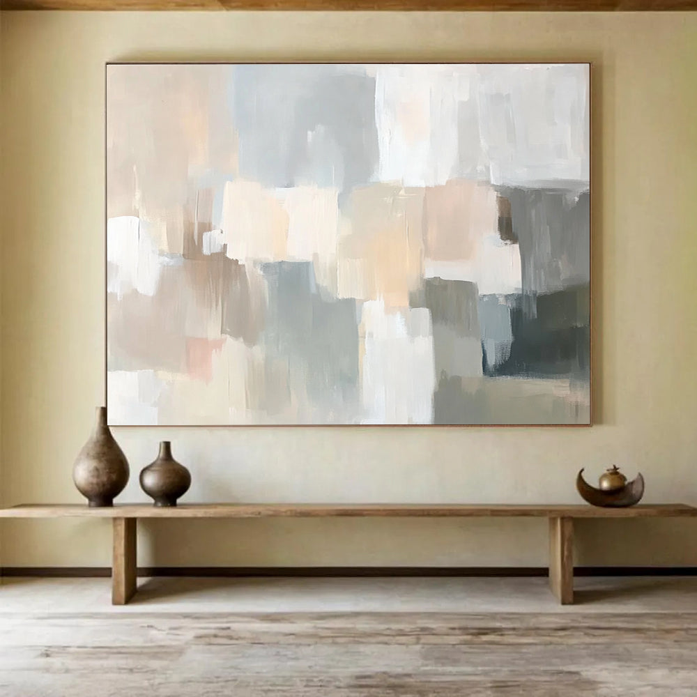 Large abstract painting in soft neutral tones featuring muted strokes of beige cream grey dusty pink pale sage green gray peach and light blue creating a serene scene.SC059
