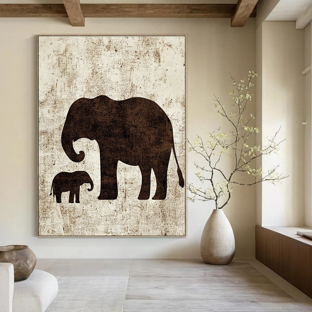 A large abstract artwork featuring minimalist silhouettes of an elephant and a baby elephant in textured brown ink on white paper.STSC1095