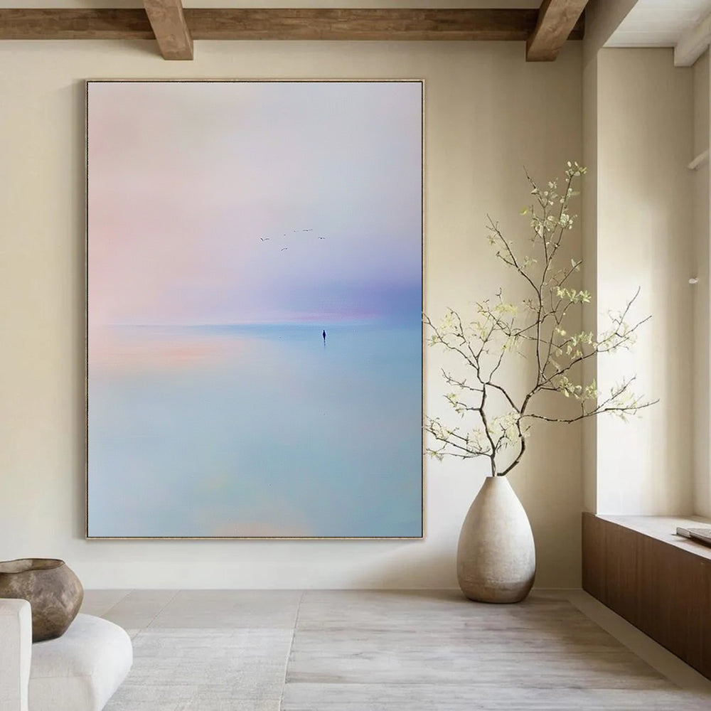 Abstract painting of the sea featuring a light blue and purple sky with soft tones and minimalist style capturing a serene beach scene with flying birds.STSC346