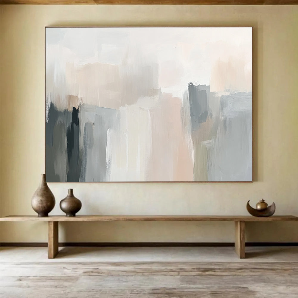Large abstract painting in soft neutral tones with gentle brushstrokes and subtle color transitions creating an elegant atmosphere.SC058