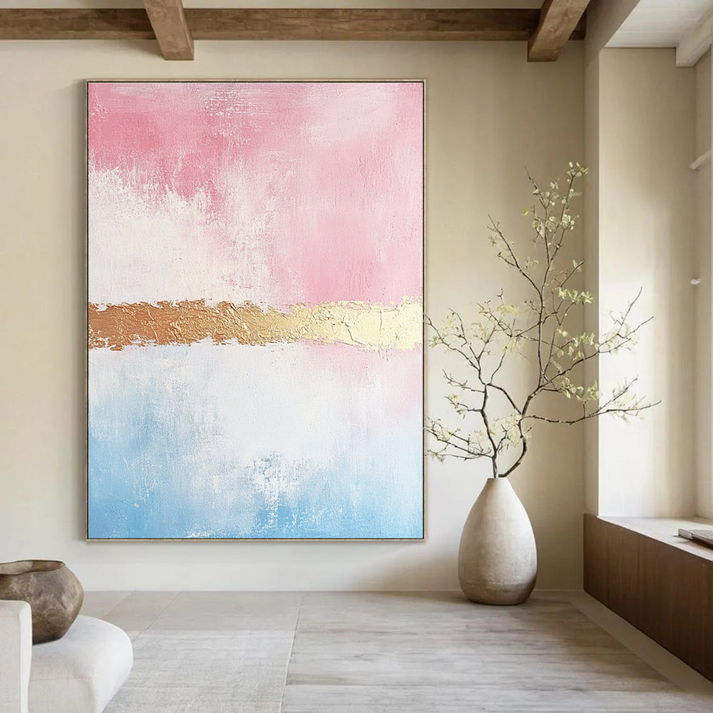 Large abstract painting with soft pink and gold tones textured brushstrokes and a delicate golden line enhancing its minimalist elegance.STSC454