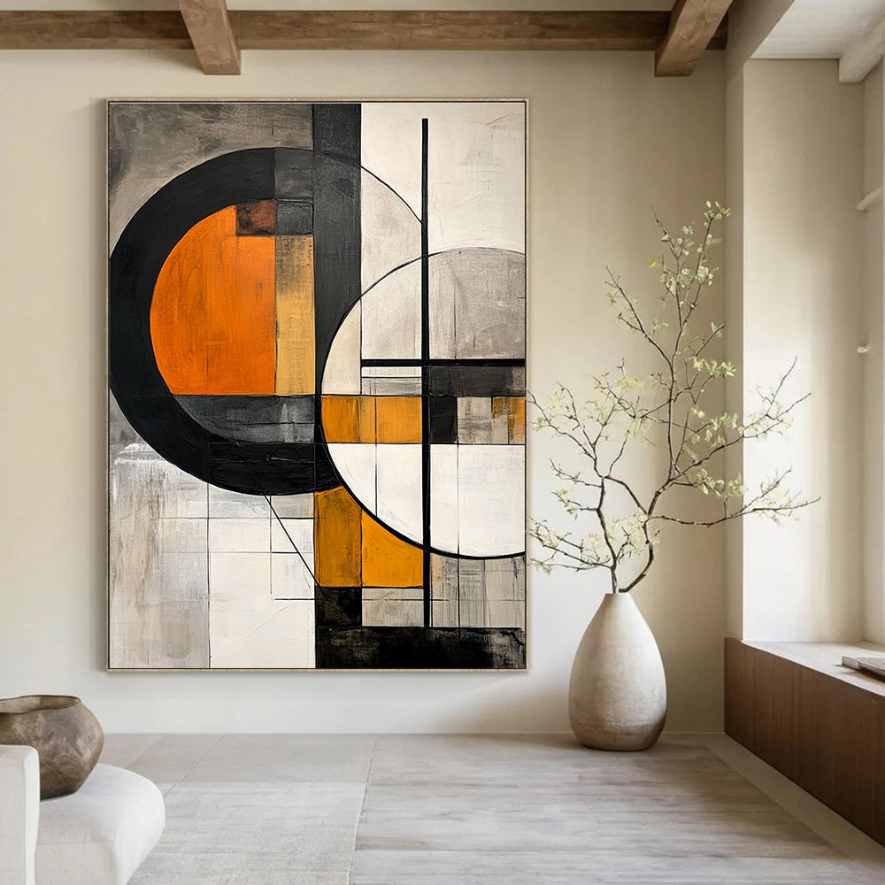 Large abstract painting featuring geometric shapes with orange interiors on a grey background accented by black lines and grey white elements.STSC222
