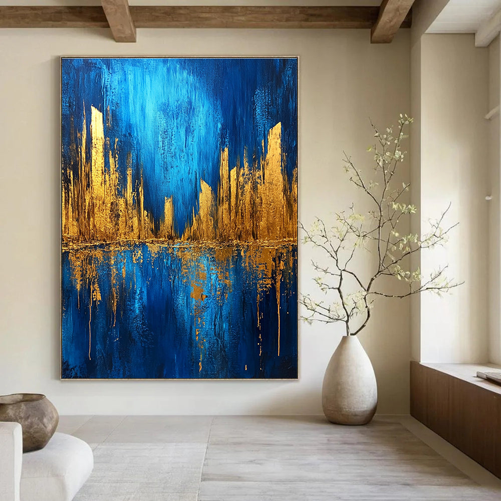 Large abstract painting featuring a metallic gold and blue cityscape on a dark textured background with bold brush strokes.STSC578
