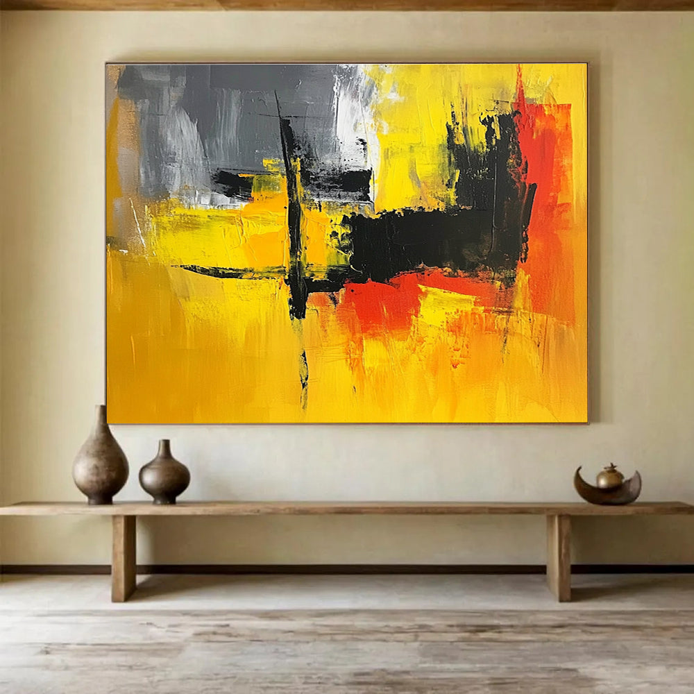 A large abstract painting featuring vibrant yellow, grey, and black hues, perfect for enhancing any contemporary space.SC393