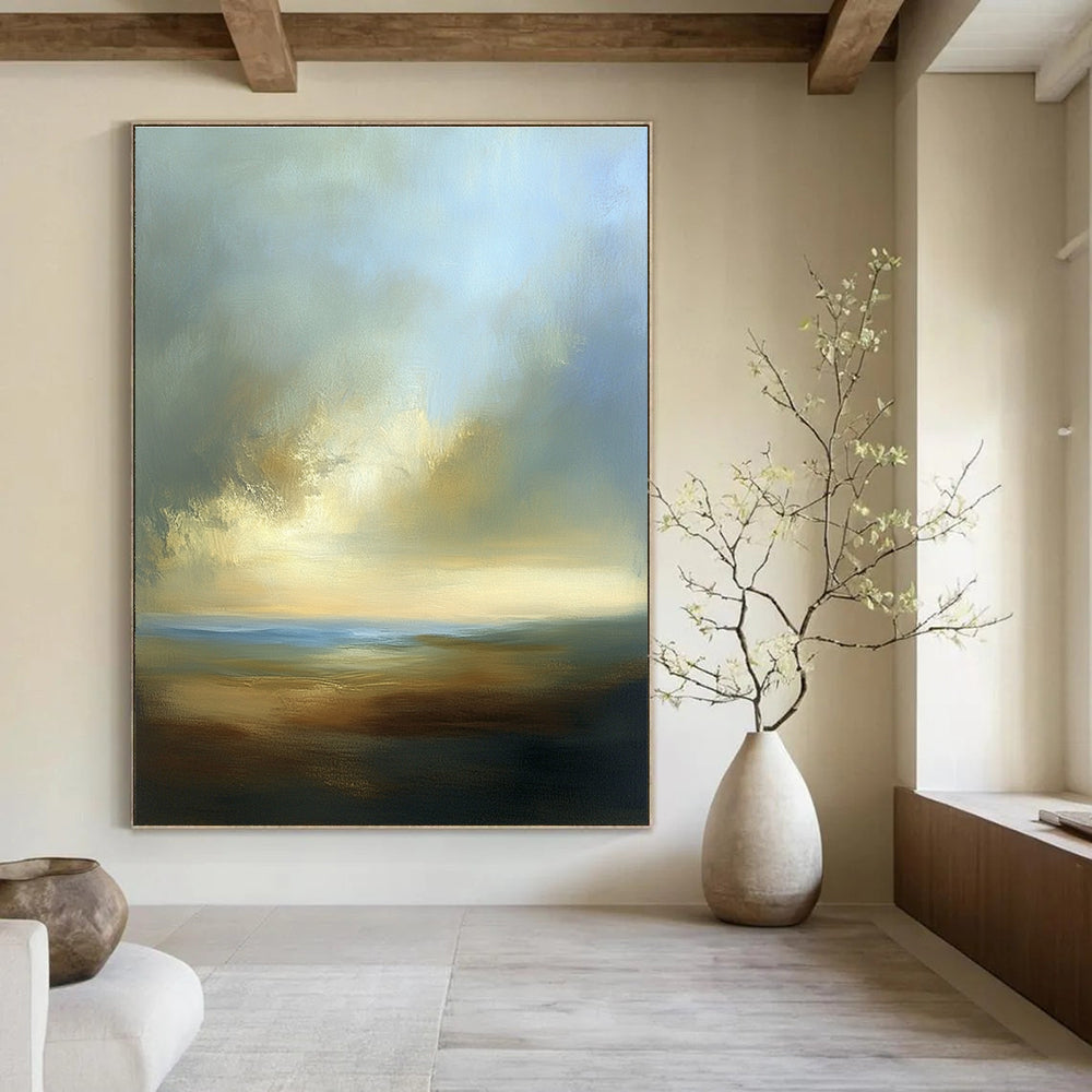 Large abstract painting depicting a dreamy sky with soft blues browns whites and beige clouds over a serene horizon at sea level.STSC886