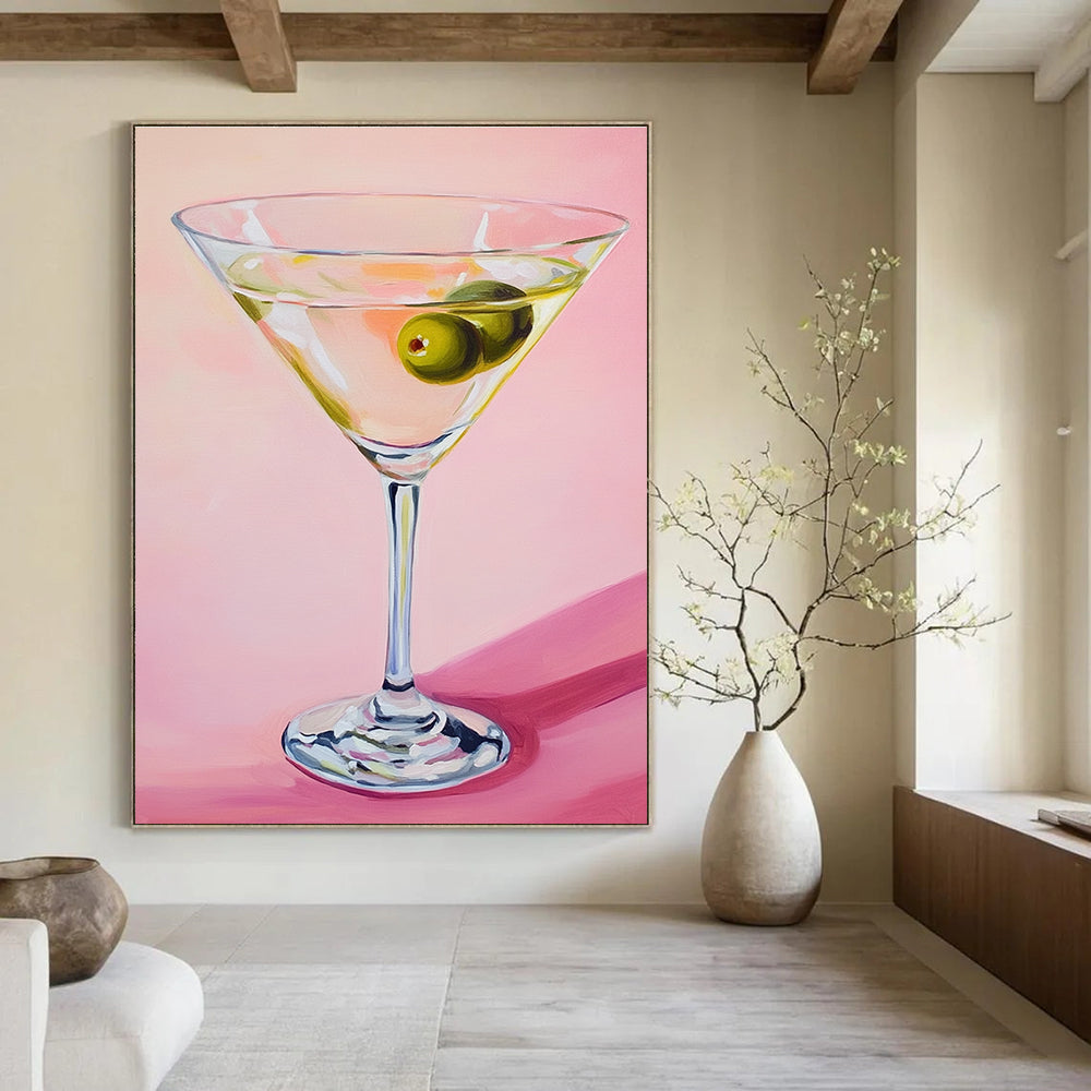 Abstract painting featuring a martini glass with an olive against a soft pink background showcasing gentle lighting and serene elegance.STSC1383