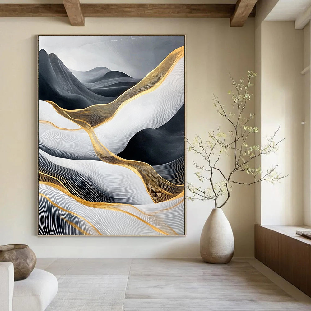 Large abstract painting of flowing waves in light gray and black with gold accents and prominent white areas and mountains.STSC358