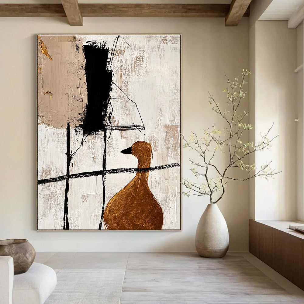 Large abstract painting featuring minimalist black lines and gold foil accents with a close-up of a golden goose in a beige color scheme.STSC466