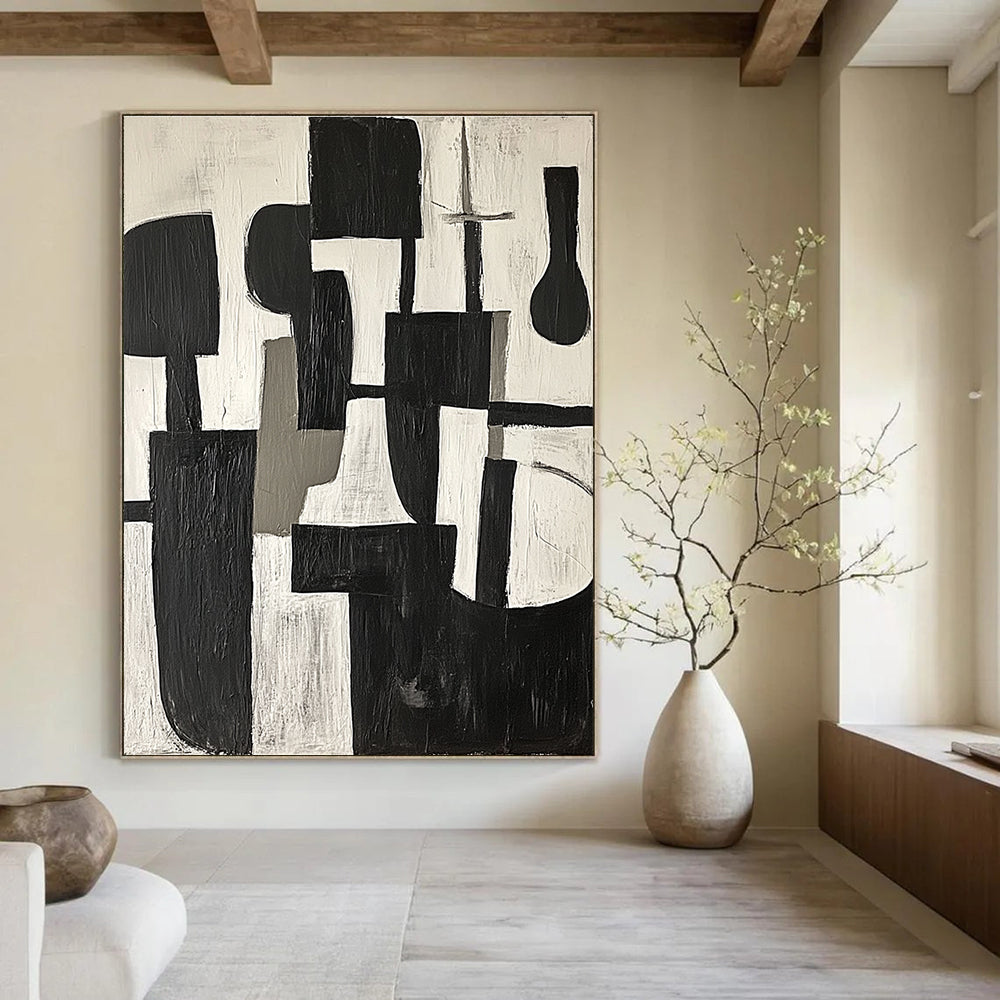 Large abstract painting in black and white shapes with gray tones on a white background embodying calmness and modernity inspired by Picasso's cubism.STSC675