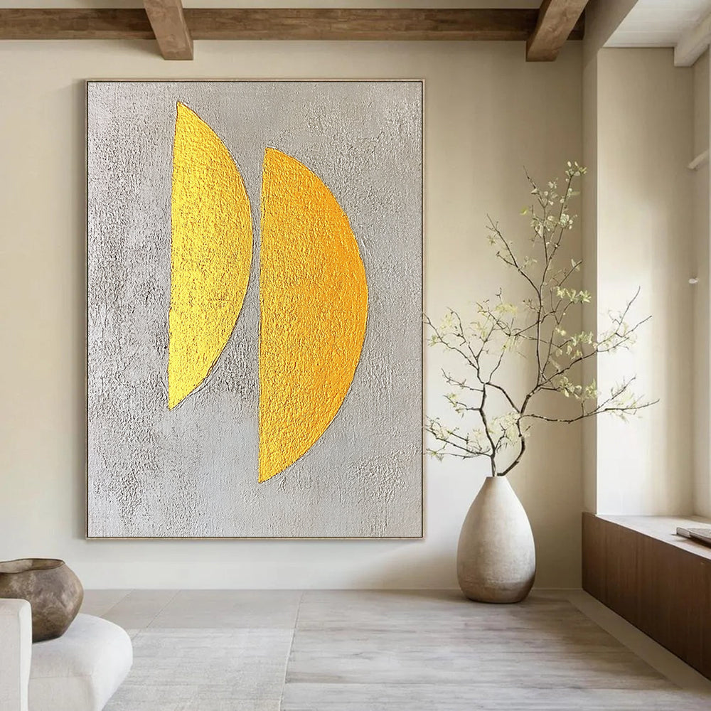 Large abstract painting featuring two yellow semicircles on a textured grey background with gold leaf highlights in a minimalist style.STSC356