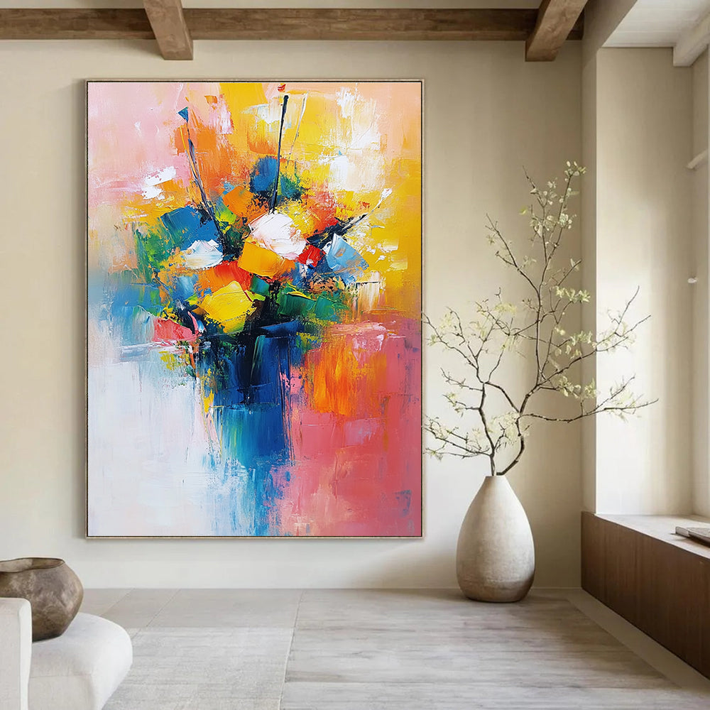 Large abstract painting featuring a vibrant bouquet in yellow blue and red with a light pink orange background conveying joy and calmness.STSC251