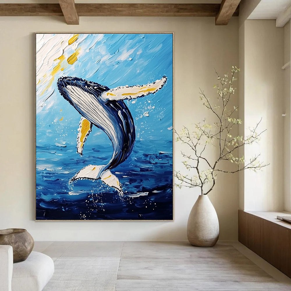 Large abstract painting featuring a majestic humpback whale mid-air with vibrant white and yellow brushstrokes against a light sky-blue and dark gold background.STSC1231
