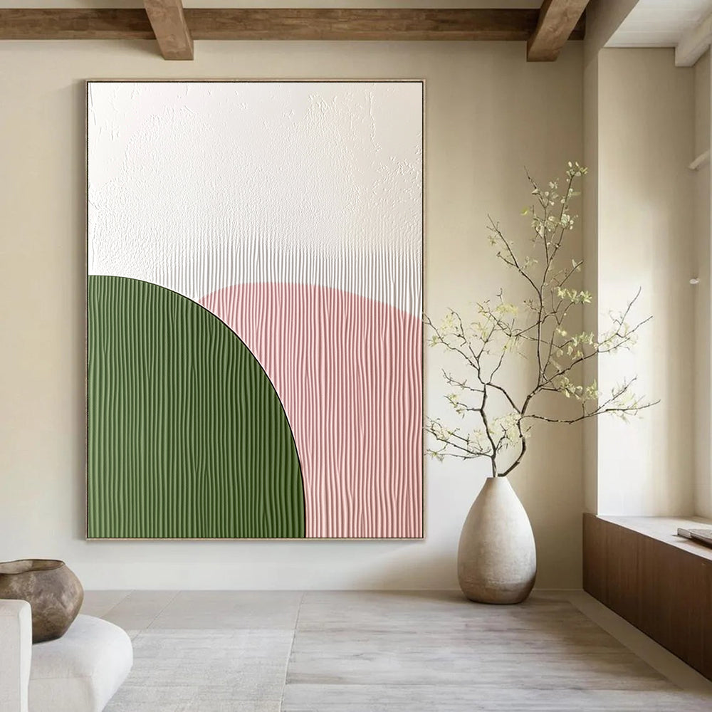 Abstract art featuring an arch-shaped wall decoration with a smooth white top and green textured paper bottom in soft pink pastel colors.STSC935