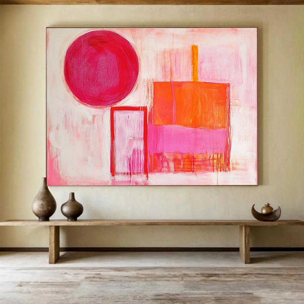 The large abstract painting features thick brush strokes with warm pink and orange hues, showcasing a circle, square, and rectangular shape.SC540