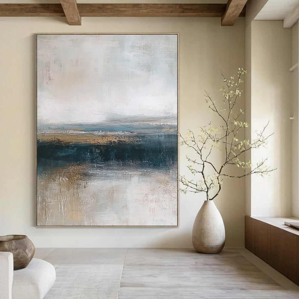 Large abstract painting depicting textured ocean waves in blue and gray with a soft beige sky and earthy shore tones for a tranquil ambiance.STSC463