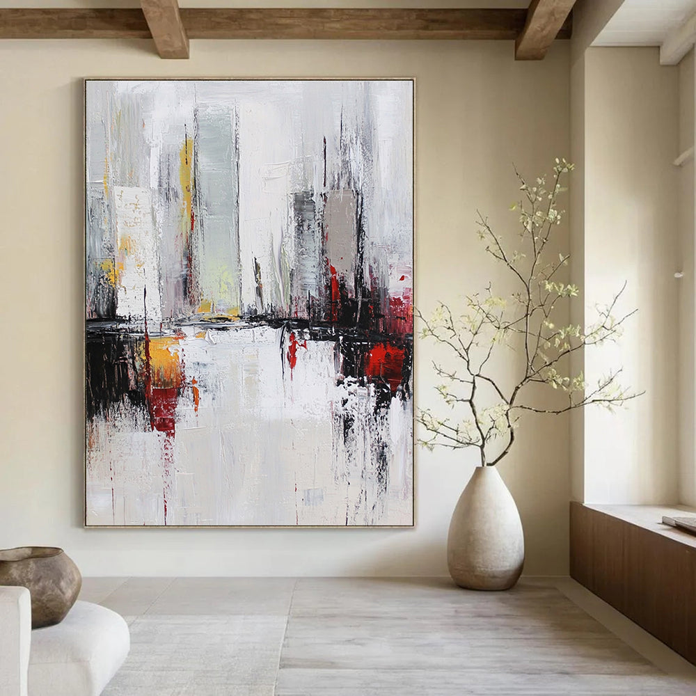 Large abstract oil painting of a cityscape in white and grey tones with red accents featuring dynamic loose brush strokes.STSC162