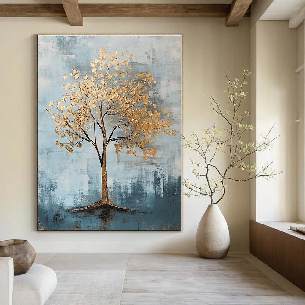 Abstract artwork featuring gold leaf accents against a cool gray and light blue backdrop with textured brush strokes.STSC838