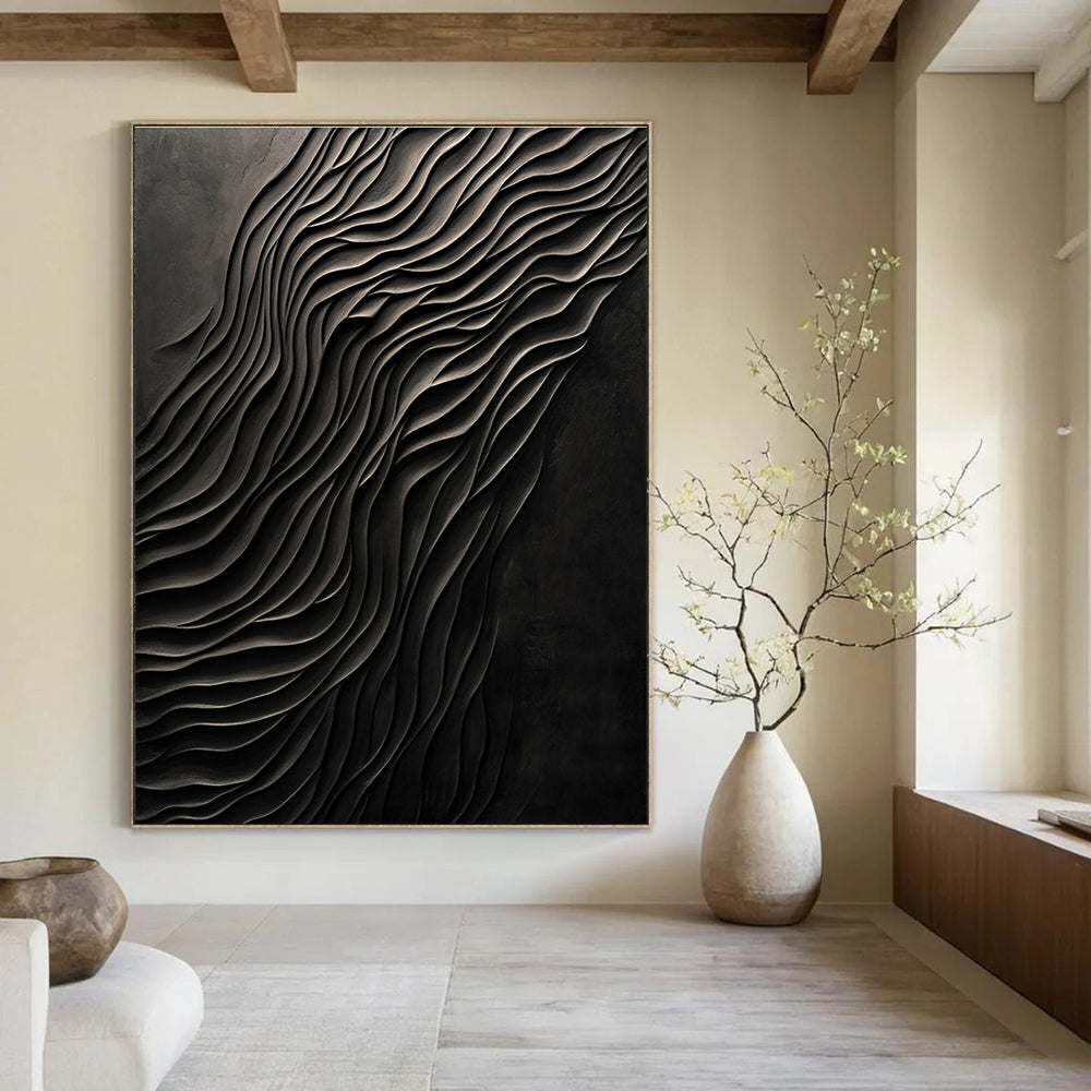 Large abstract art piece featuring dark carved wood with smooth forms and a monochromatic gray palette creating a mysterious atmosphere.STSC1289
