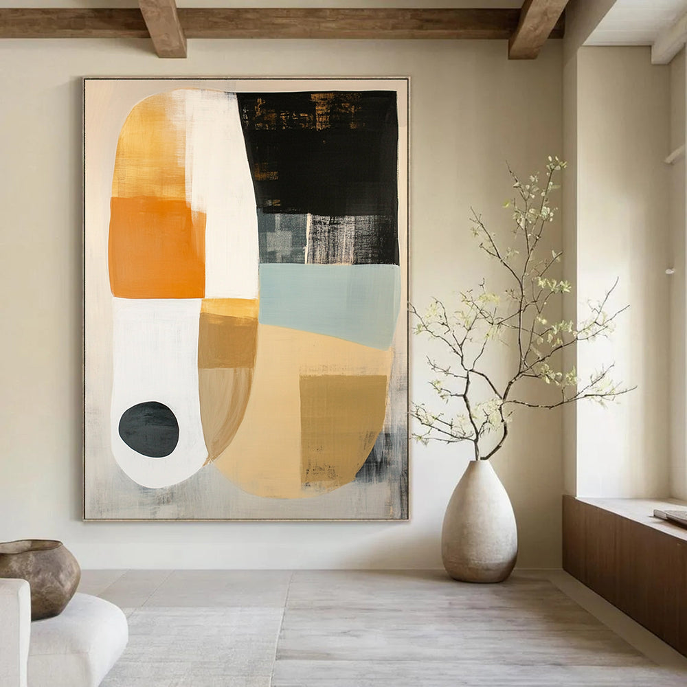 Large abstract painting featuring white beige and black shapes on soft gray with orange circle and light blue oval accents.STSC762