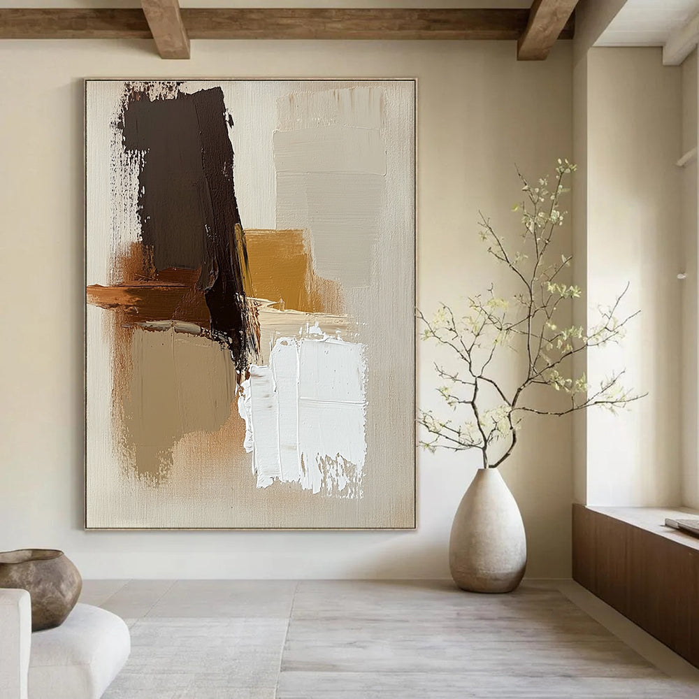 Large abstract painting with brown beige and white colors featuring thick brush strokes and simple shapes on a neutral beige background.STSC747