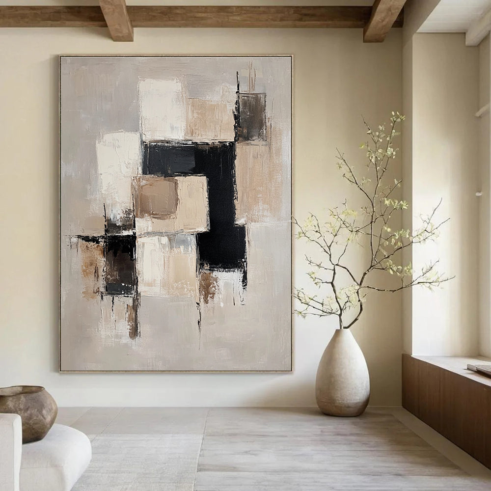 Large abstract painting with beige and white blocks black accents and soft edges on a light gray background creating an elegant minimalist feel.STSC220