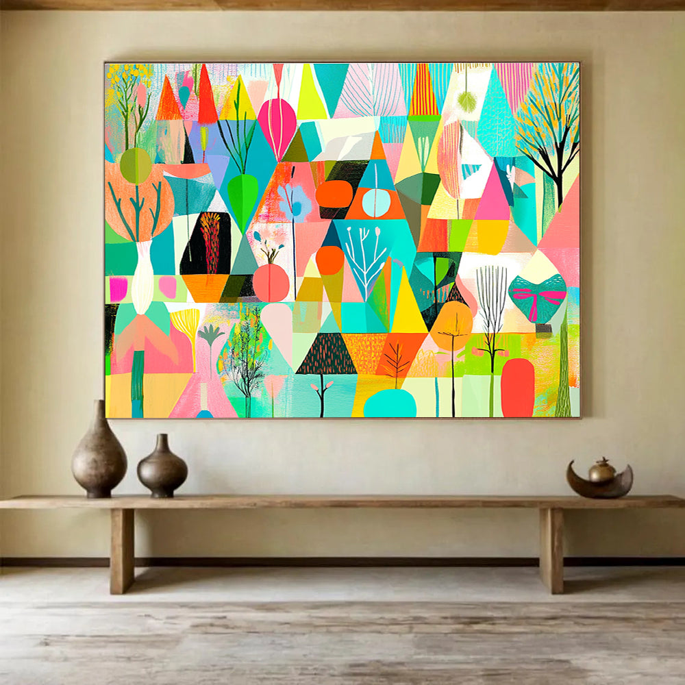 A large abstract painting featuring vibrant geometric shapes in shades of green pink blue yellow and orange with floral elements and nature motifs.SC563