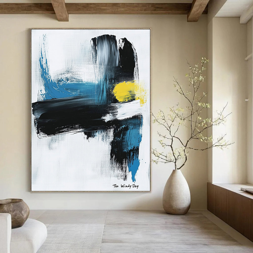 Large abstract painting in black and white with blue or yellow accents on light gray background featuring text The Windy Day.STSC1070