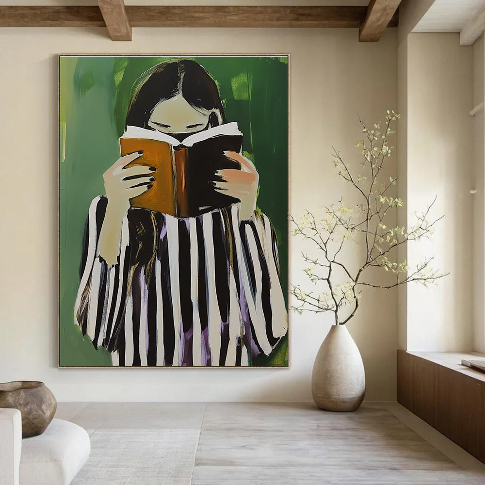 A large abstract painting featuring a woman in black and white stripes holding a book and coffee against a green background.STSC1258