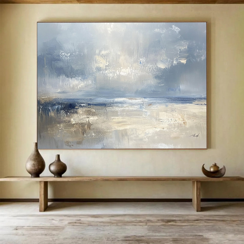 Large abstract seascape in cool blues and grays with warm beige accents capturing serene coastal beauty and a misty horizon.SC278