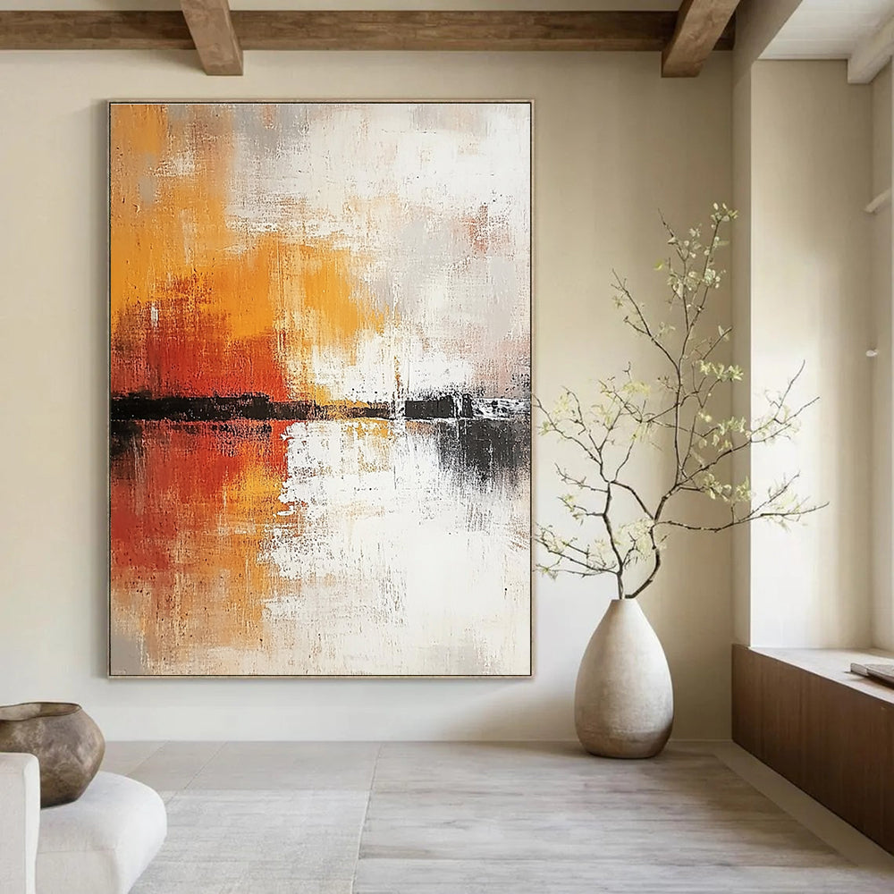 Large abstract painting in soft white and grey tones with warm orange and yellow accents featuring expressive brush strokes and rich texture.STSC813