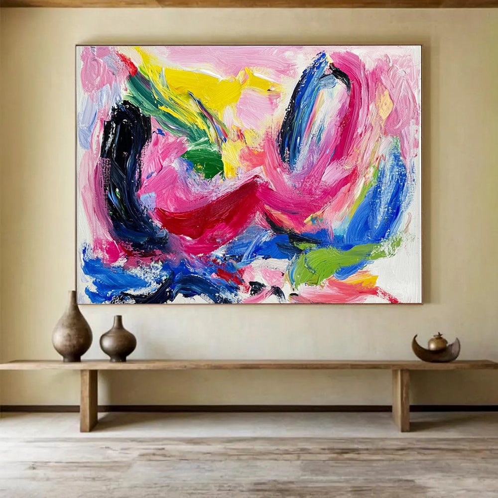 Large abstract painting featuring vibrant pink and blue hues thick brush strokes and dynamic black swirls with red lines and green shapes on a white backgroundSC150