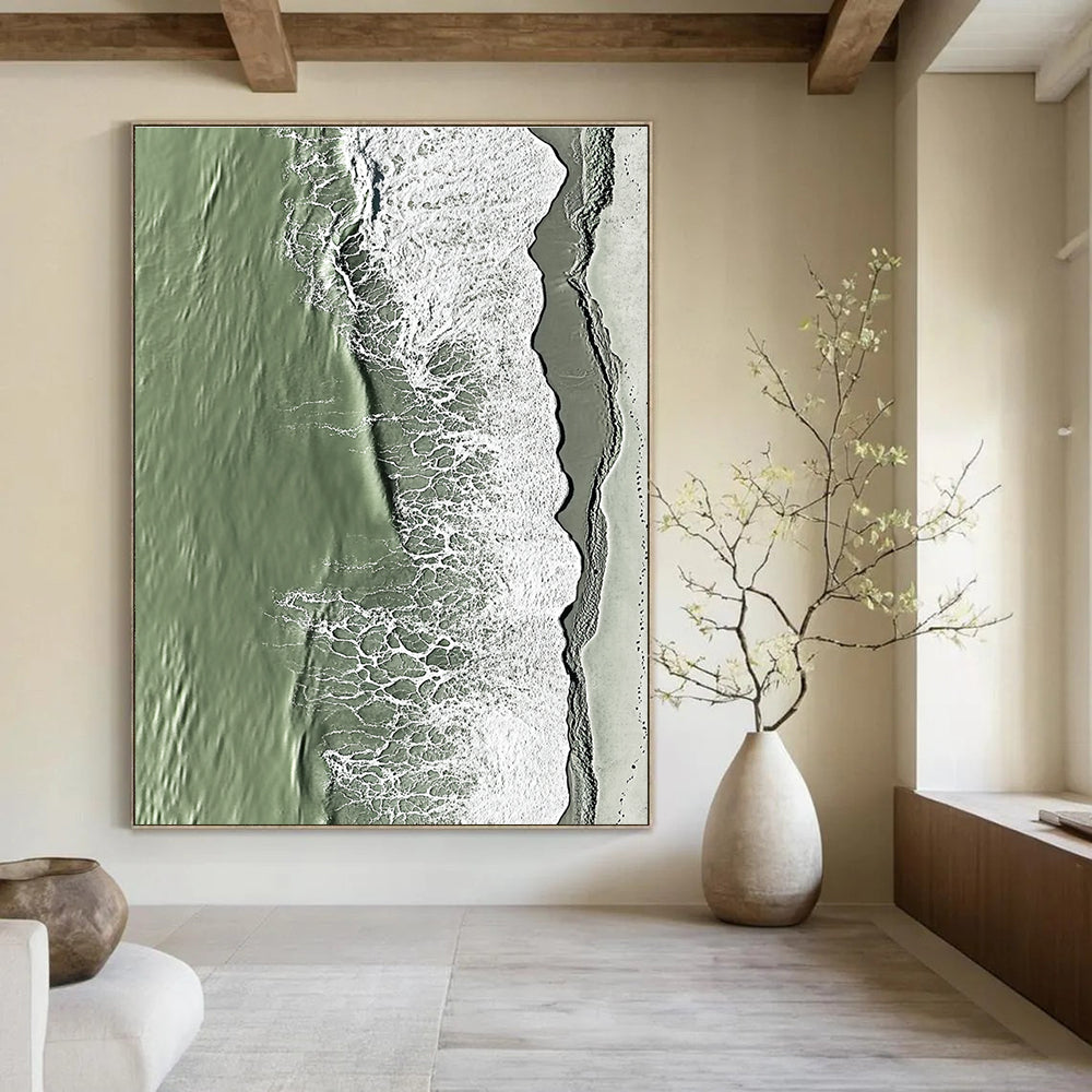 A large abstract painting capturing the serene edge where sand meets water in green and grey tones with rolling waves.STSC1158