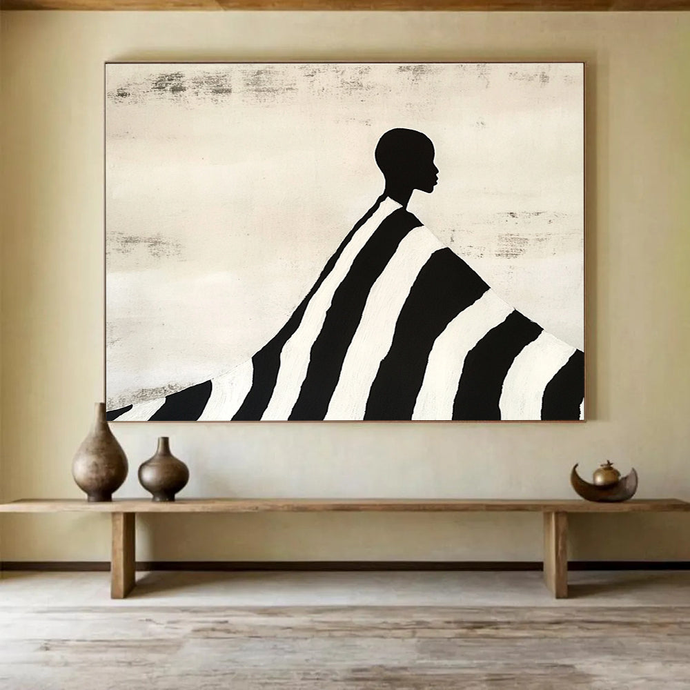 An abstract painting featuring a silhouette of an African man draped in a black and white striped blanket, evoking Tim Walker's artistic style.SC428