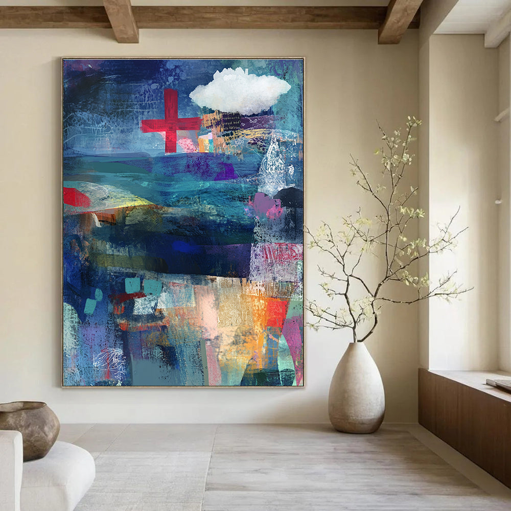Abstract mixed media collage of the sea in blue and purple with a red cross and white cloud layered with fabric ribbons and watercolor splashes.STSC575