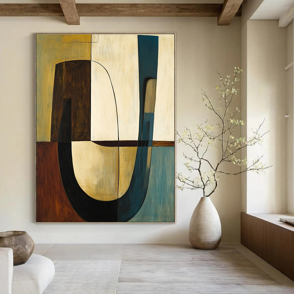 Abstract painting featuring shapes and lines in olive green with brown accents complemented by a large curved table and two chairs.STSC693