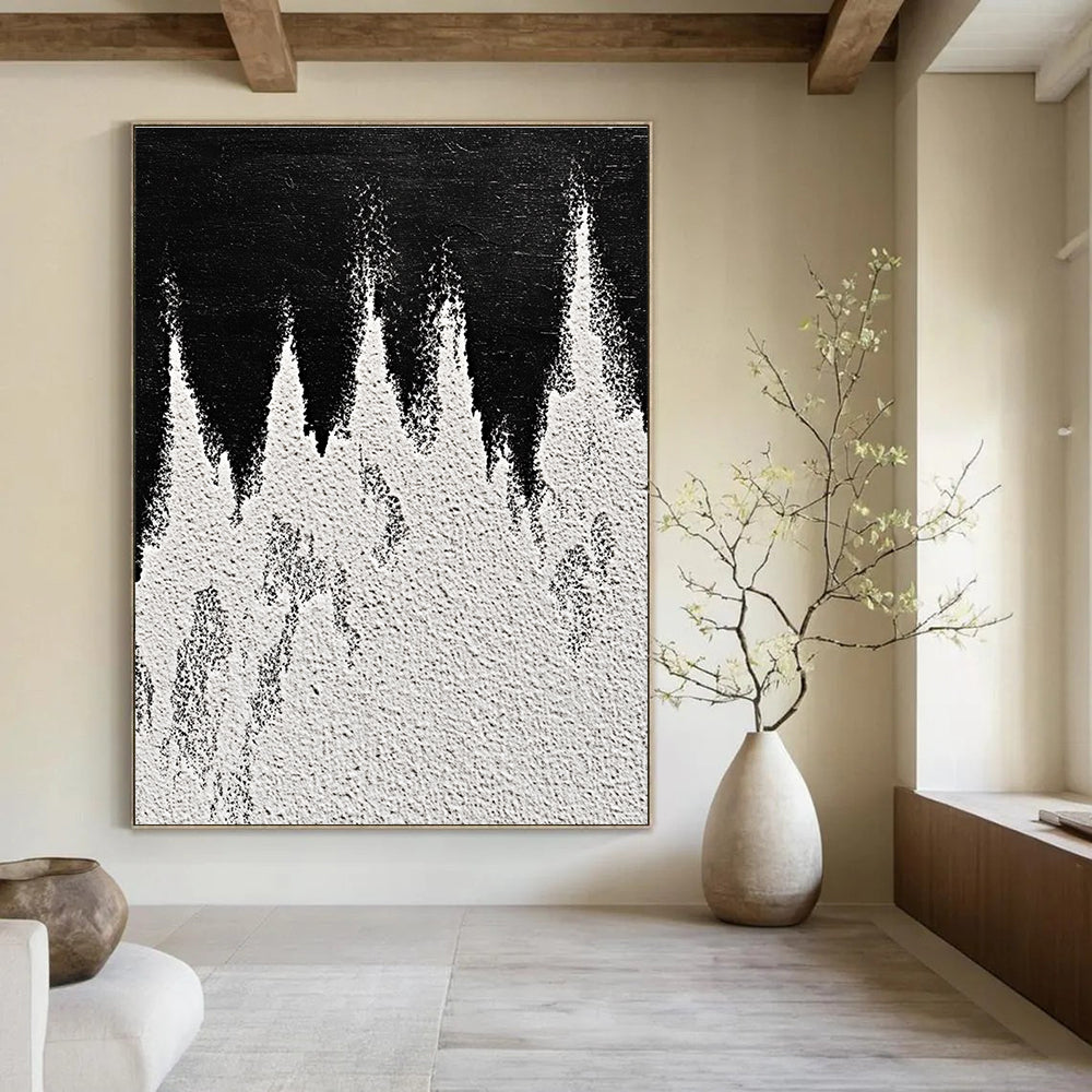 A large abstract painting featuring white powder on a black background with textured mountain ranges in playful gray and white tones capturing sharp edges.STSC1487