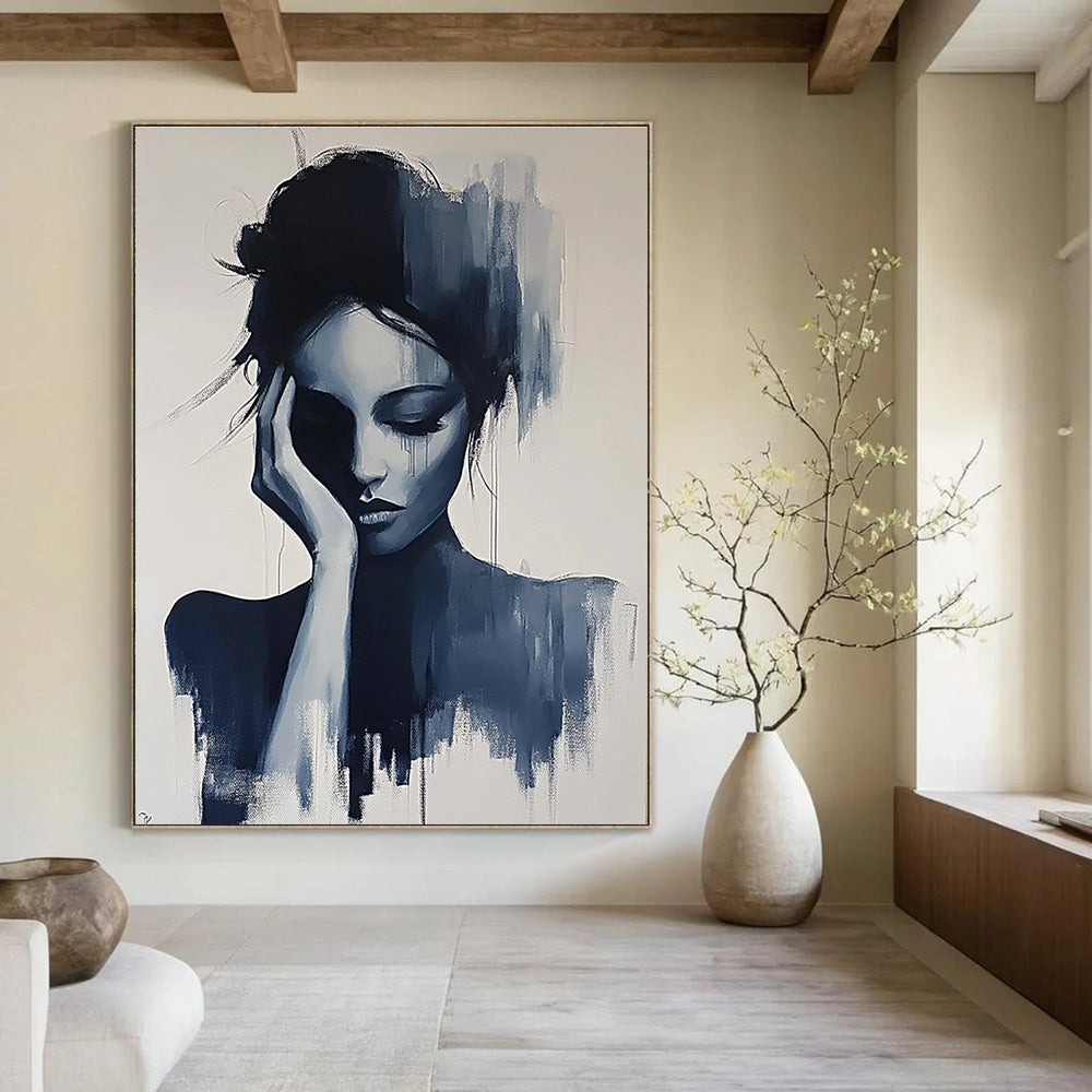 Large abstract painting of a gray woman with her hand on her face and hair up in black and white colors.STSC1378