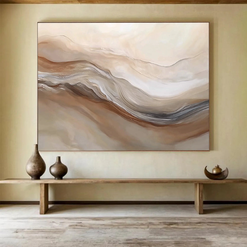 Large abstract painting featuring swirling beige and white hues resembling desert dunes capturing movement and depth in a serene landscape.SC447
