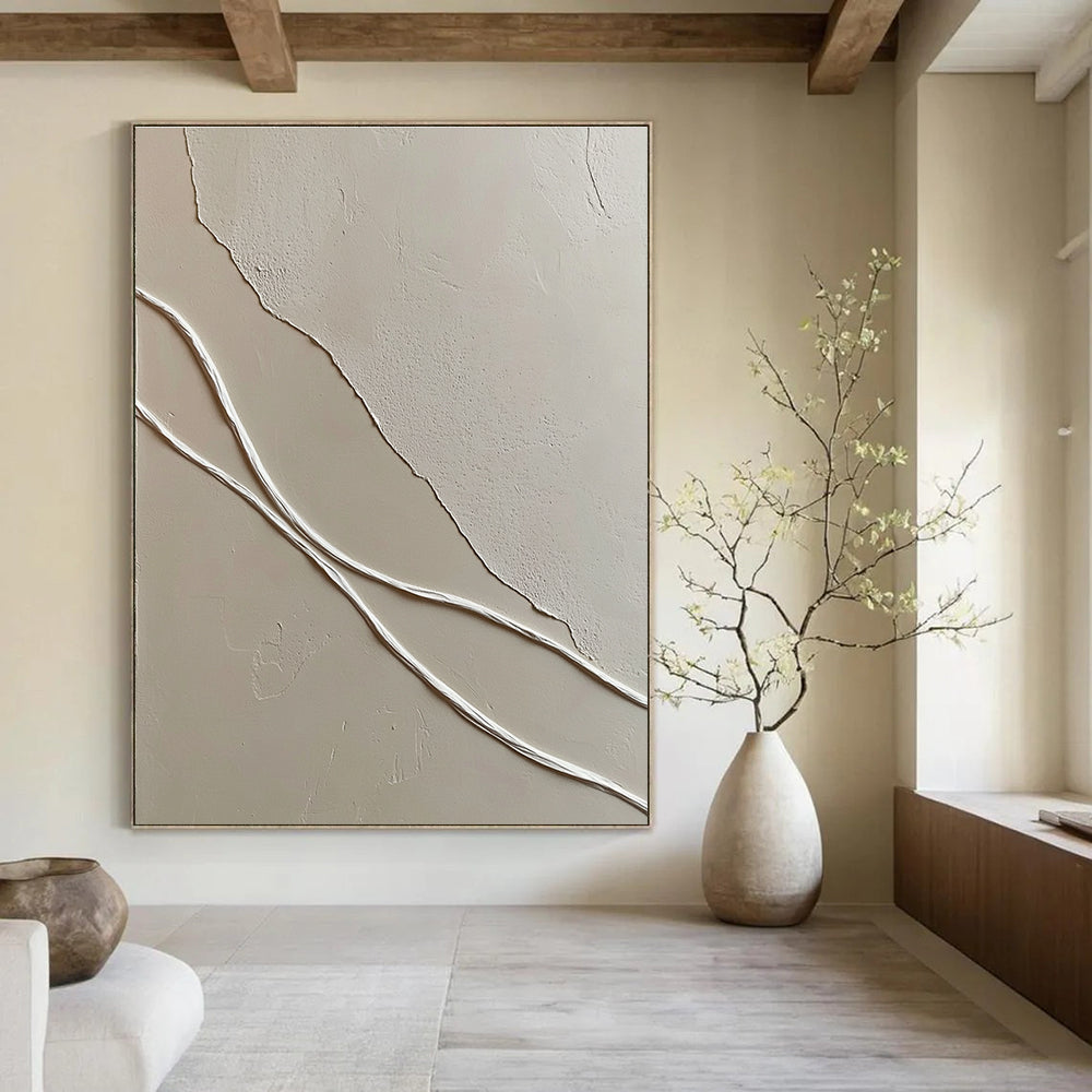 A large abstract painting featuring smooth white wavy lines against textured light-colored plaster walls enhancing depth in a minimal space.STSC941