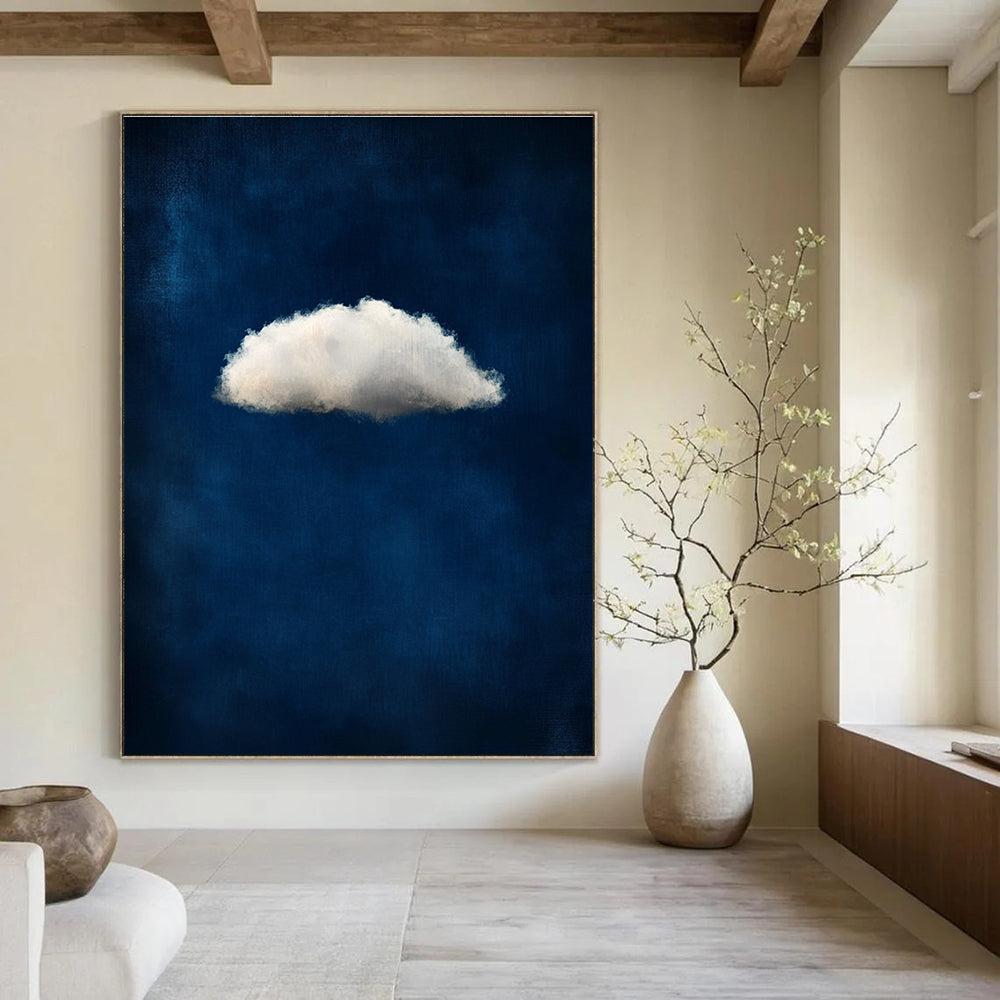 A large abstract painting featuring a small white cloud on a dark blue background evoking ethereal and dreamy atmospheres with soft tones.STSC1403