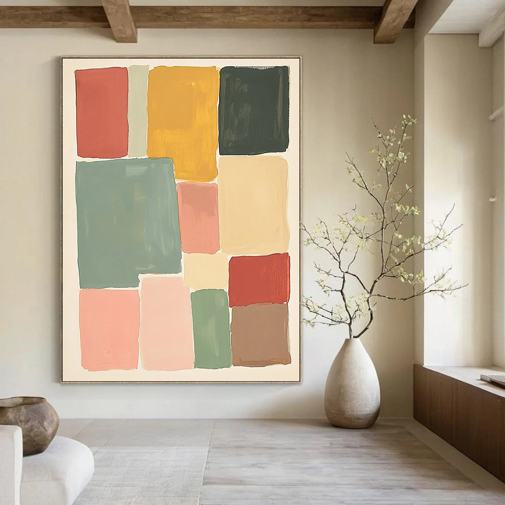 Large abstract painting featuring muted colors and soft hues in thick block shapes of sage green pink red and yellow against a white background.STSC1361