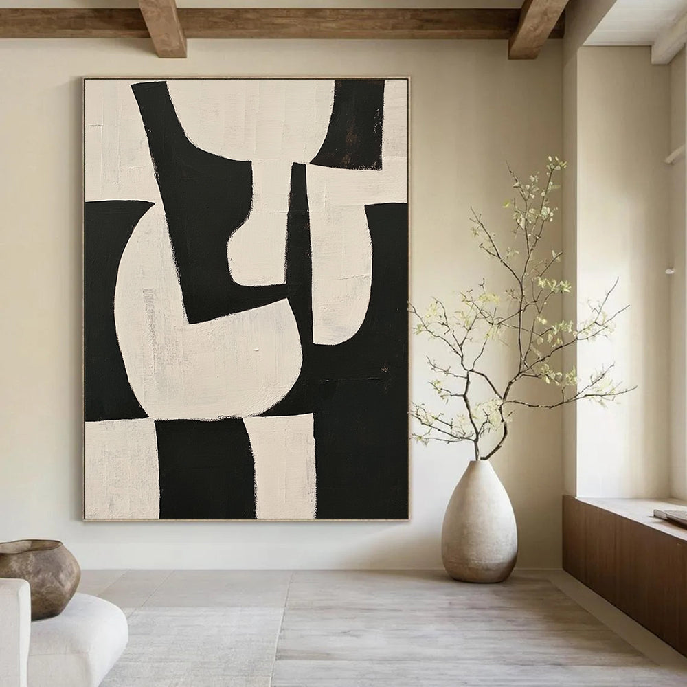 Large abstract painting featuring black and white shapes on a beige background with organic forms and overlapping lines for depth and elegance.STSC329