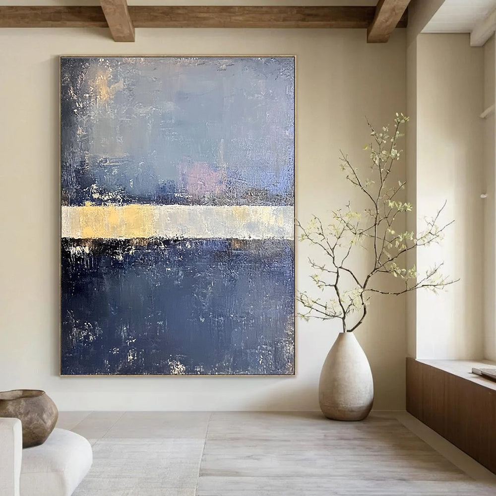 Large abstract painting in faded hues of blue gray and pale yellow with soft edges on a dark gray background featuring a white bar.STSC218