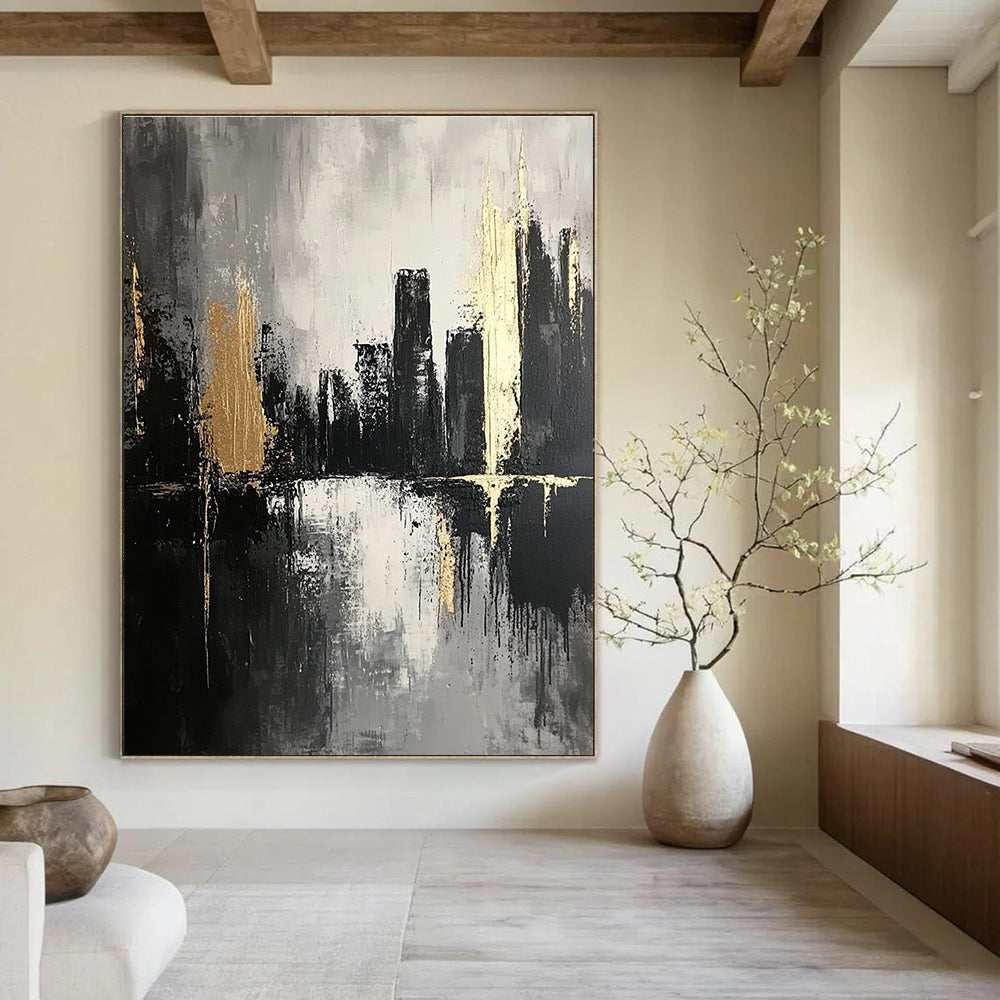 Large abstract painting featuring thick brush strokes in dark grays and subtle gold highlights creating an atmospheric monochromatic cityscape on canvas.STSC020