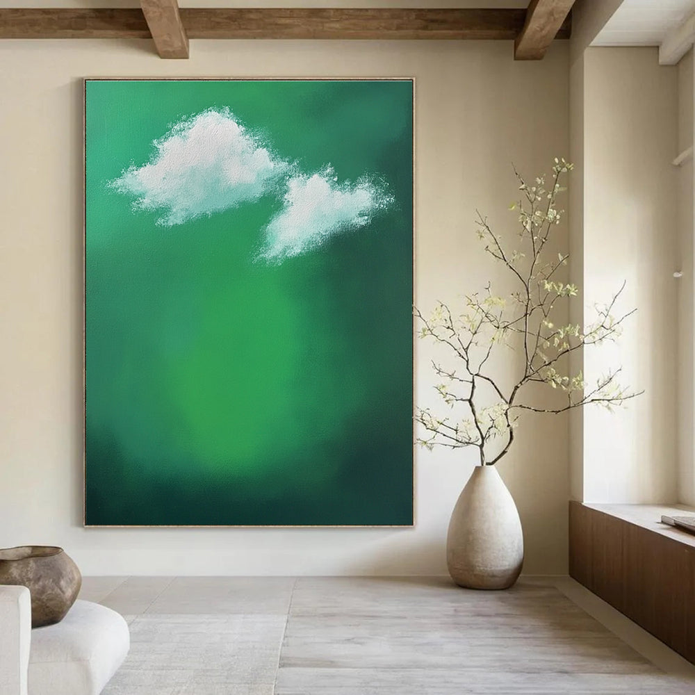 Large abstract painting featuring a green background with white clouds and sunlight effects evokes tranquility and calmness through minimalist brushstrokes.STSC1008