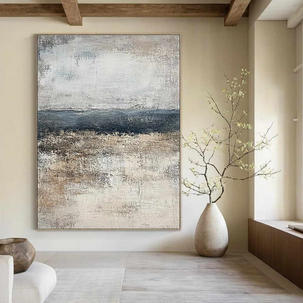 Large abstract painting of the ocean in muted gray and beige tones, featuring a calming neutral color palette that enhances any space.STSC491
