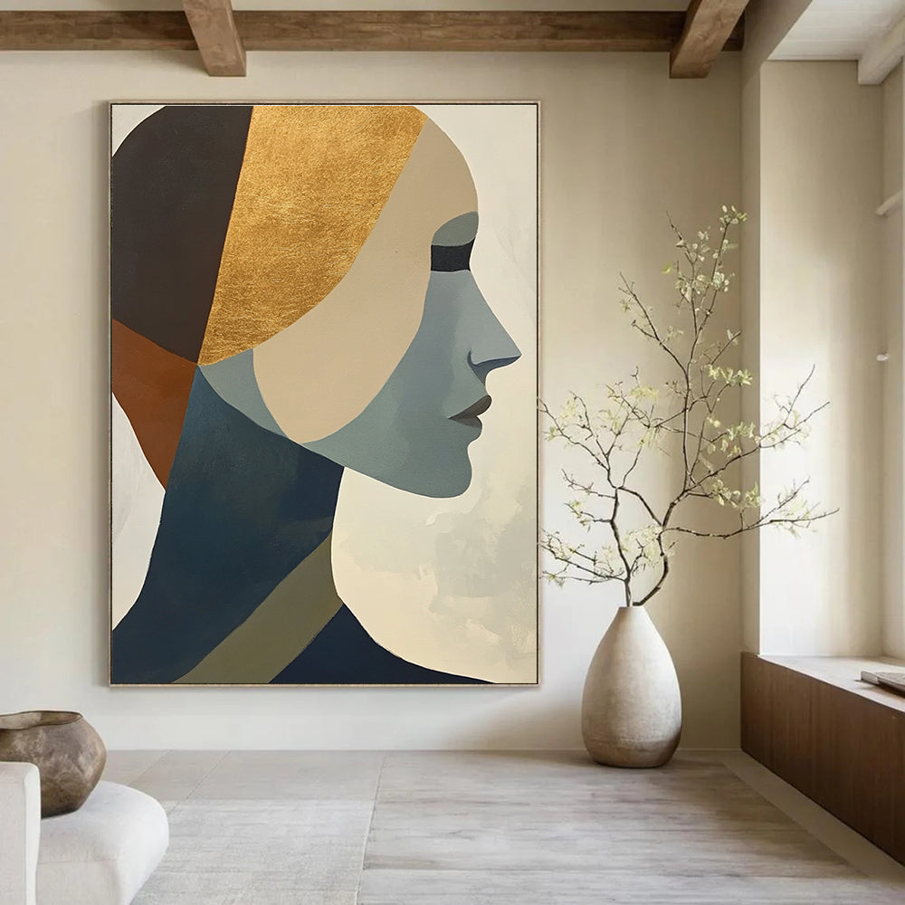 Large abstract painting featuring cubist shapes and lines muted colors gold foil accents and a hint of the female form.STSC692