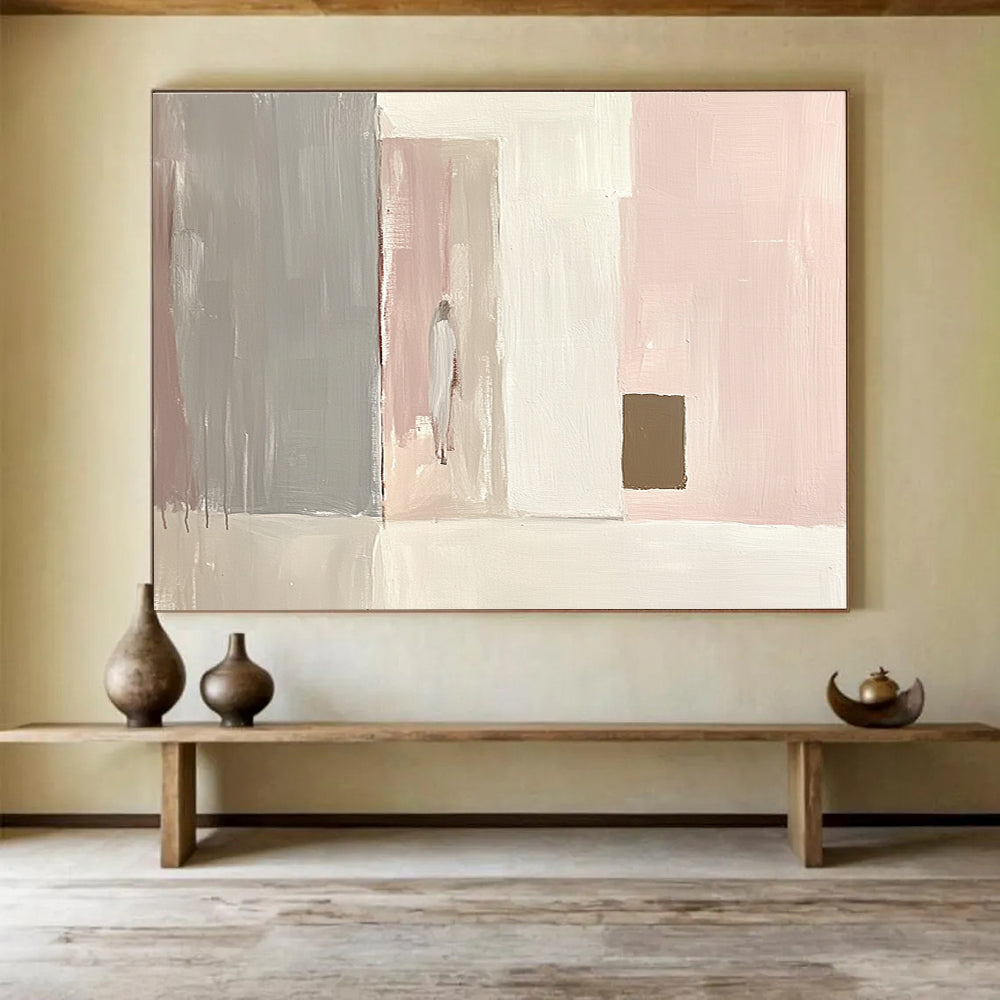 Large abstract painting in light pink and white with gray and a small brown square emphasizes minimalist brushstrokes and elegant simplicity in oil paint.SC223