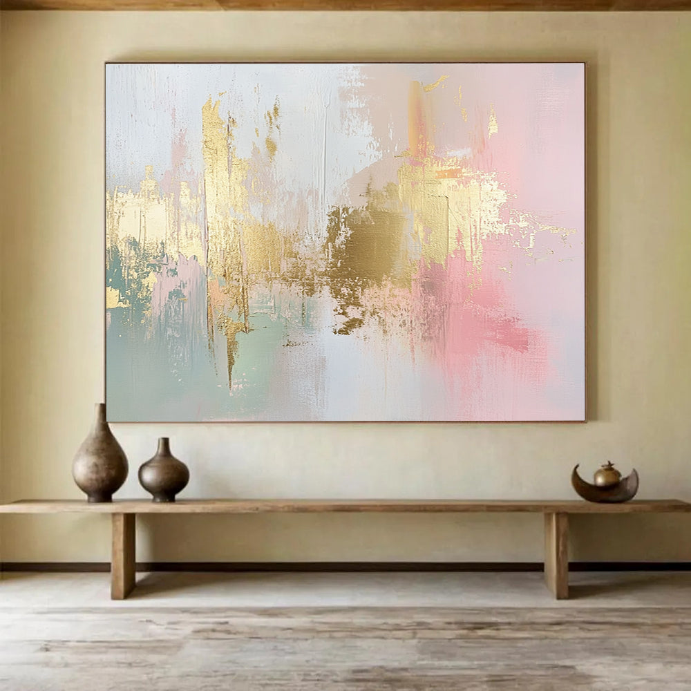Large abstract painting in soft pink, white, and gold with hints of light green and neutral tones, featuring dynamic brush strokes and a modern art style.SC283